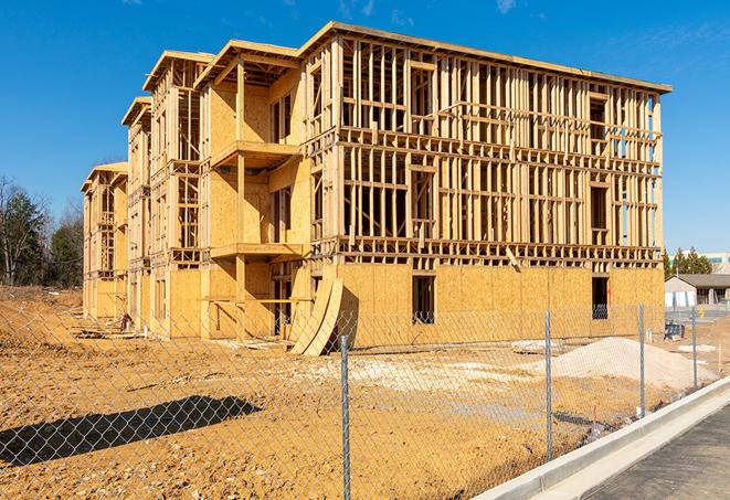 a panoramic view of temporary chain link fences on a job site, separating work zones in Temecula, CA